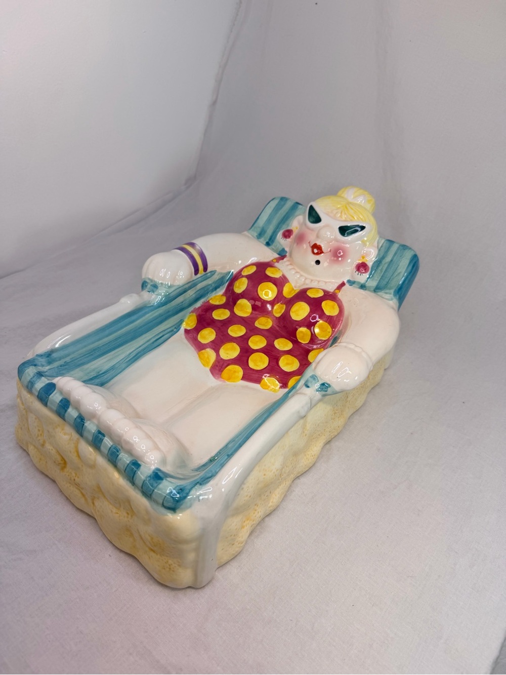 Hand-Painted Ceramic Lounger Figurine in Yellow and Pink